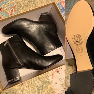 Women’s Michael Kors mid-booties.
